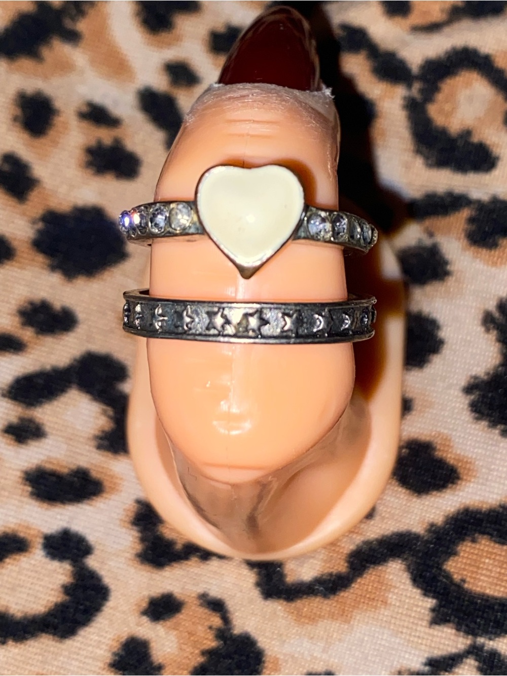 Silver star ring and a white heart-shaped ring